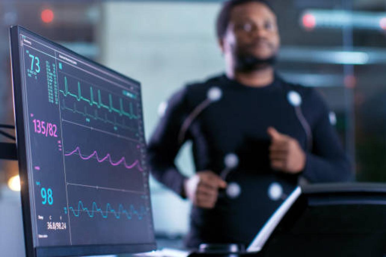 Athlete on treadmill with monitor