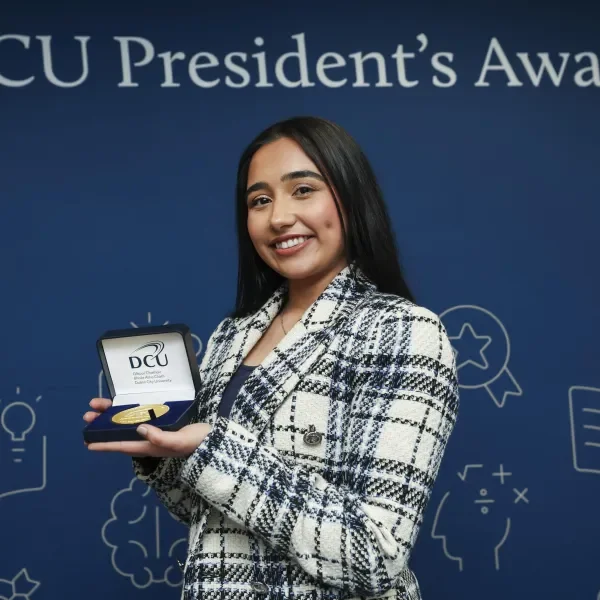 Malhs with the medal in her hands