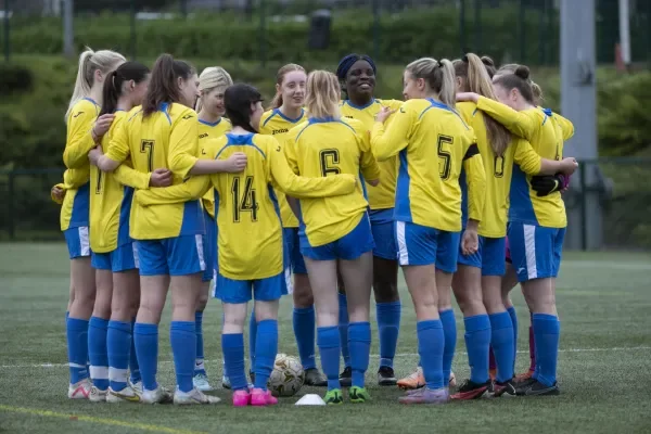 Shows DCU Ladies football team in huddle