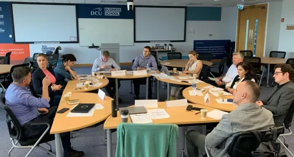 Shows Dr Gezim Visoka leading roundtable session
