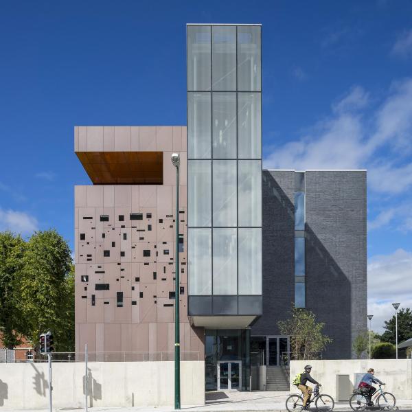 A modern building with a glass middle.