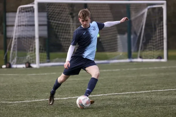 DCU Sport soccer player kicking the ball