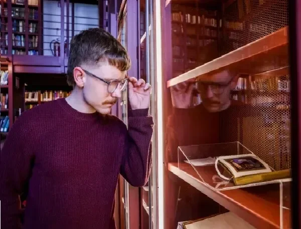 Student looking at an exhibition in Woodlock Hall
