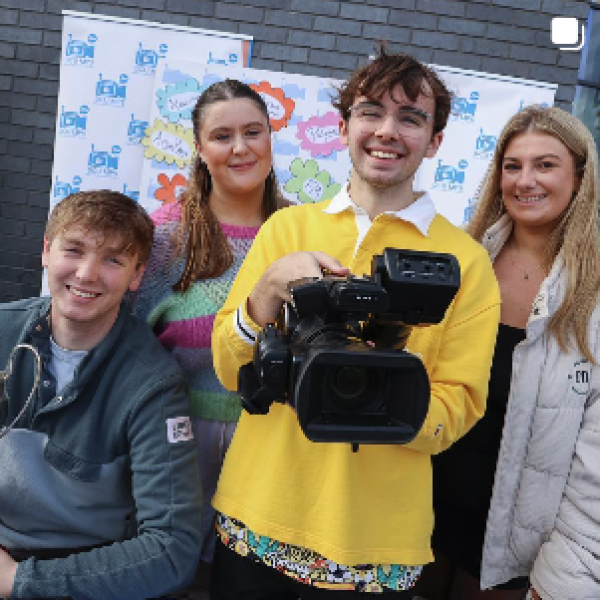 Shows three students during DCU Clubs & Socs day 
