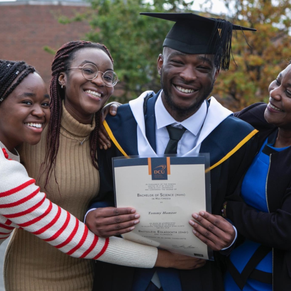 Shows DCU graduate with family 