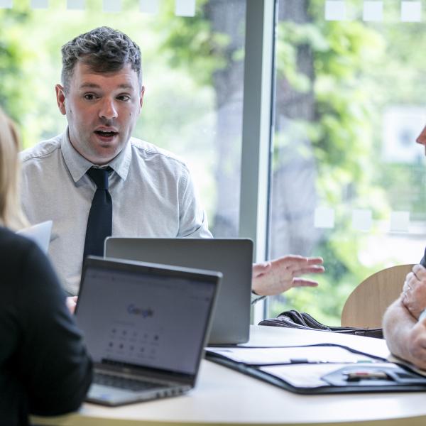 Shows members of DCU staff in discussions