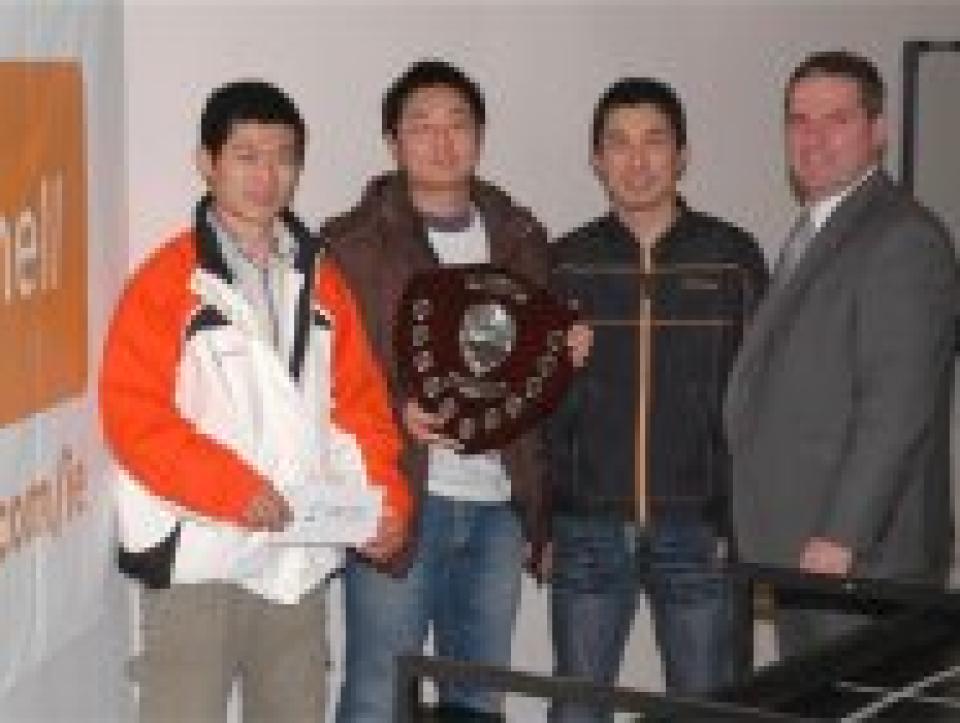 Dian Zhang, Xiang Ye, and Keyang Dai receiving their prize from sponsor Mr. Pat Devlin, of Farnell Ireland.
