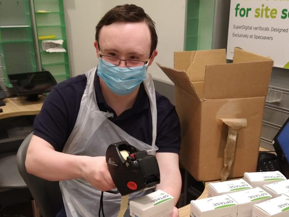 learner working in an optician shop