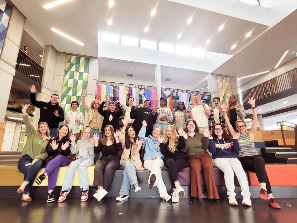 Group photo of our new 22-23 Access Ambassador sitting on the colourful chairs in the U Building after their ambassador training.