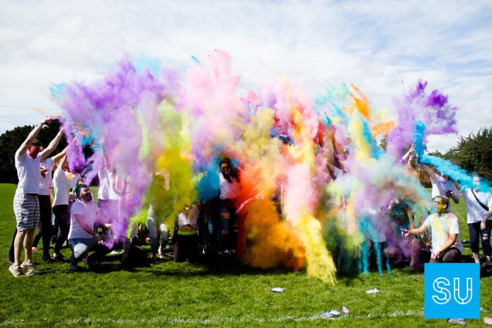 A group of students celebrating Holi