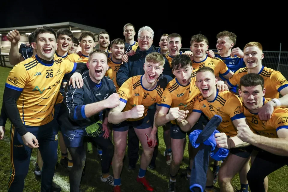 Sigerson cup winning team celebrating victory with President Daire Keogh 2025