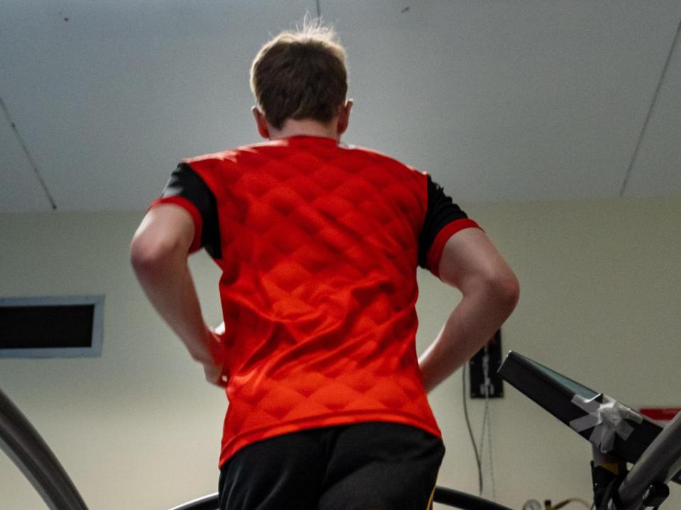 Test subject running on a treadmill in a laboratory 