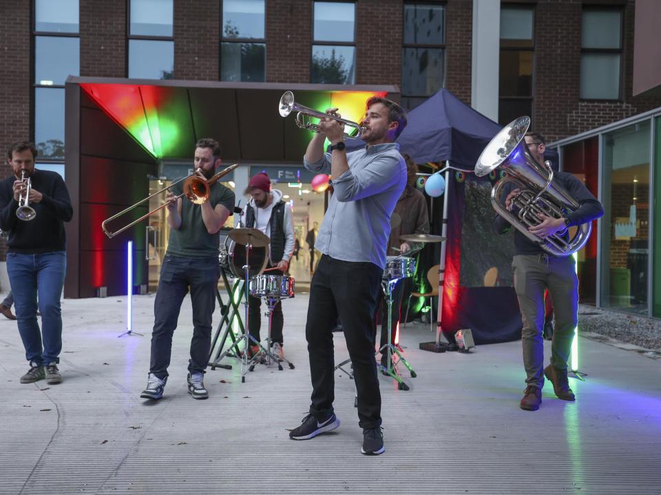 Stomptown Brass play outside Cregan Library