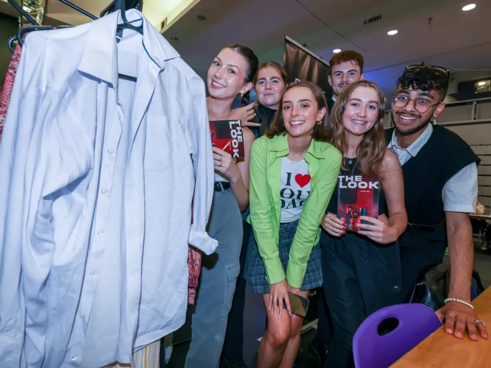 Students pose for a picture at Clubs and Socs Fair
