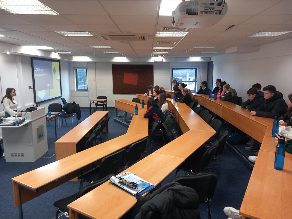 Lecturer teaching students in a classroom