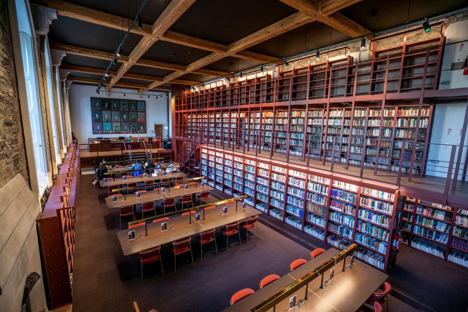 Five students sit studying in Woodlock Hall Library