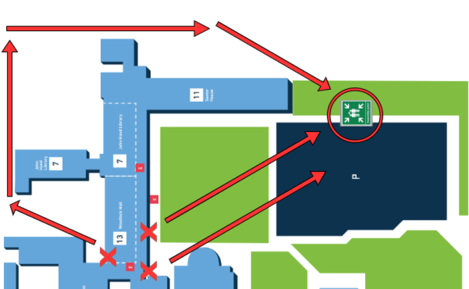 Image showing fire assembly point for Woodlock Hall Library, located on the left-hand side of the map, half way down. Three exits around the library are marked by red crosses. Fire assembly point is located at top right of image, in the large car park between the chapel and senior house. This is beyond the patch of grass outside the library.