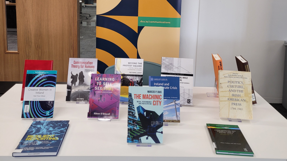 Shows a display of books published by the DCU School of Communications