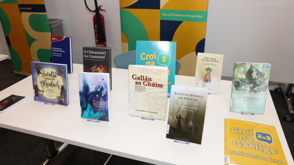 Shows a display of books published by staff members in the DCU School Fiontar agus Scoil na Gaeilge
