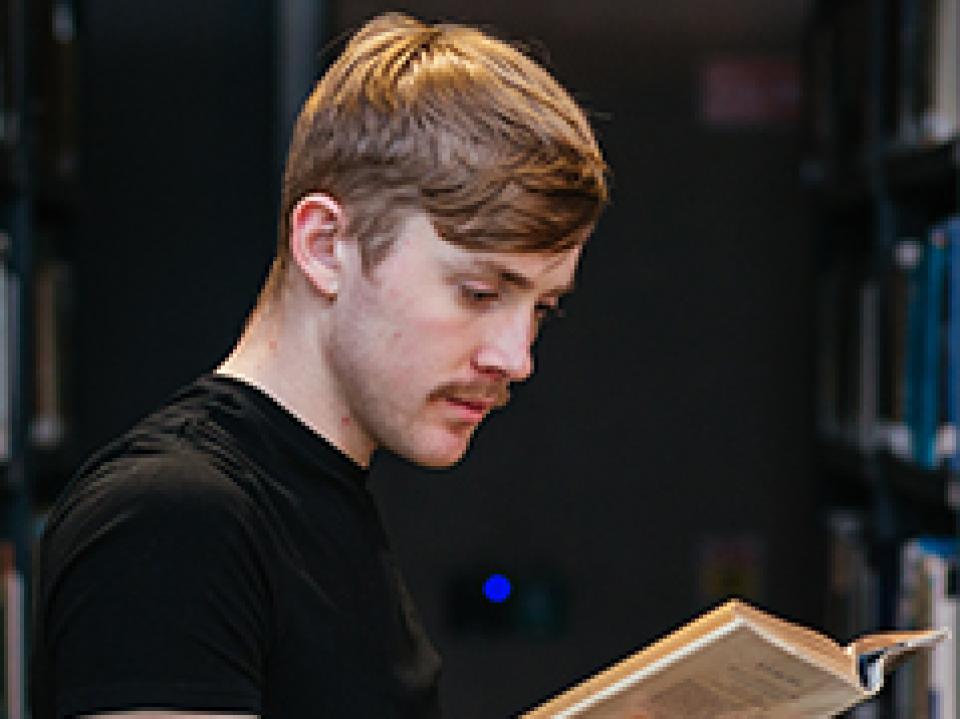 Student reading a book