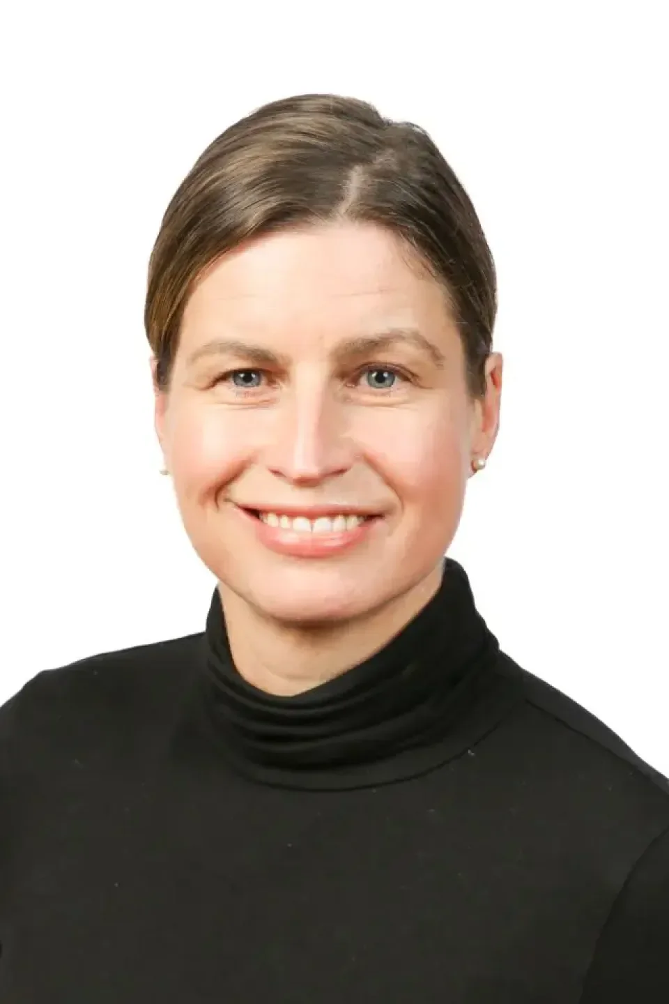 woman with brown hair in a black polo neck against a white background