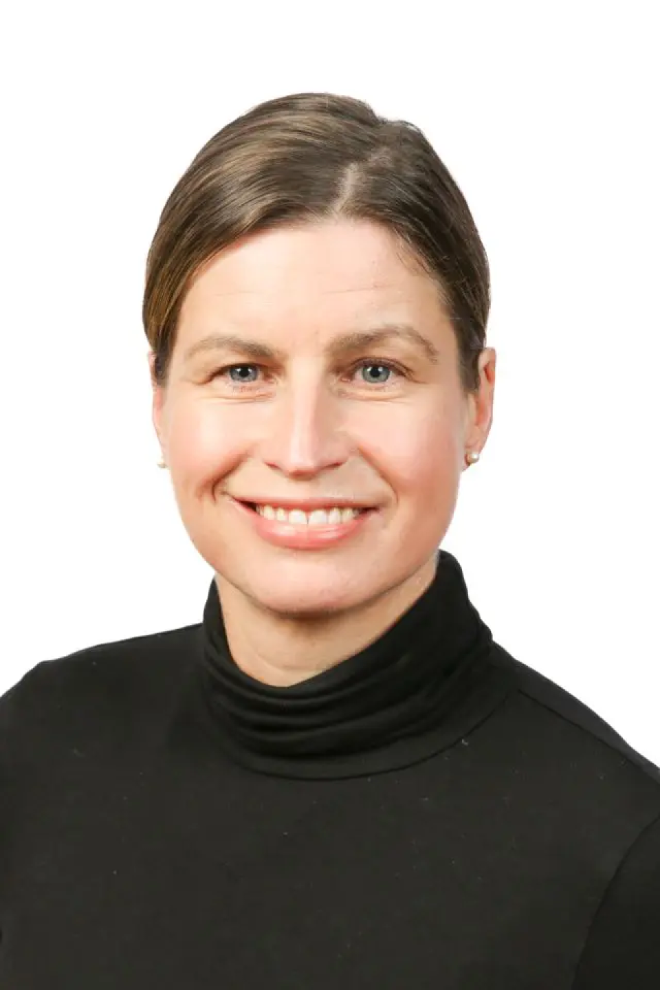 woman with brown hair in a black polo neck against a white background