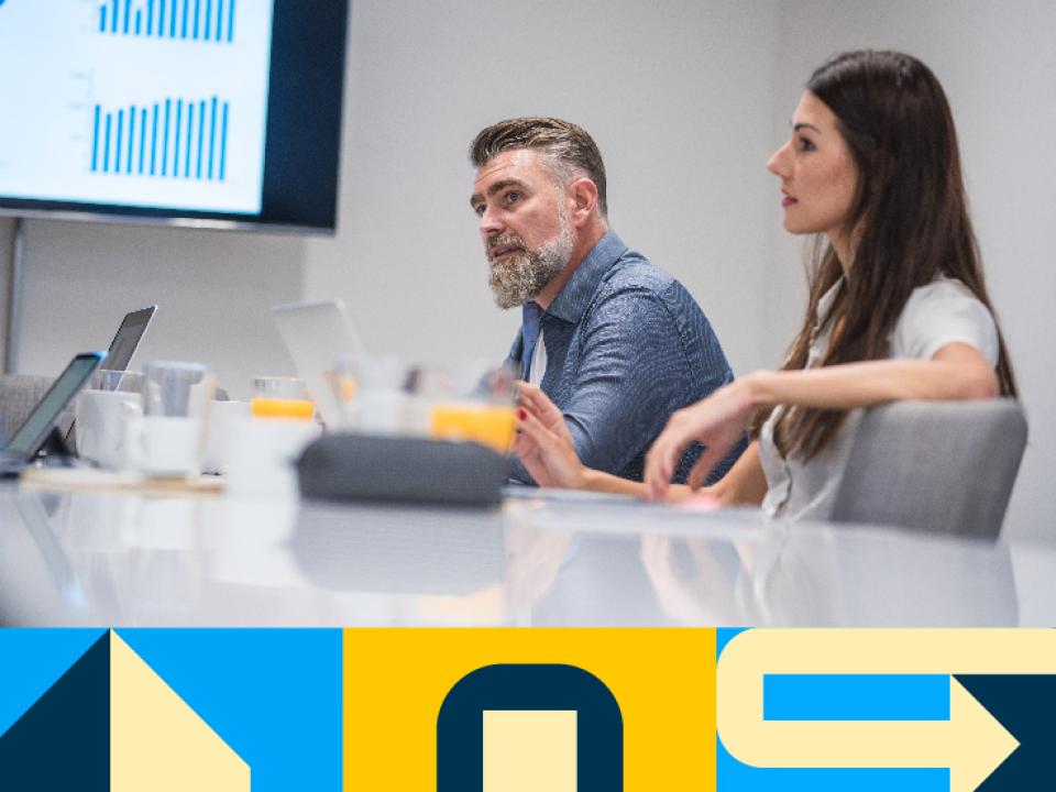 Shows man and woman in meeting room 