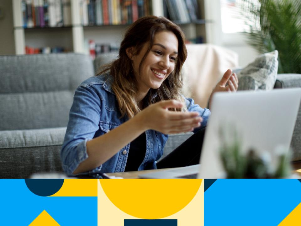 Shows woman sitting in front of laptop talking to somebody virtually 