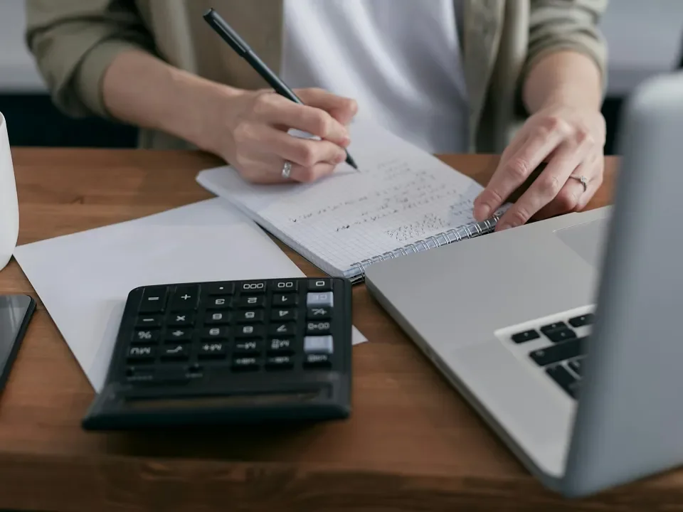 Person making calculations on paper