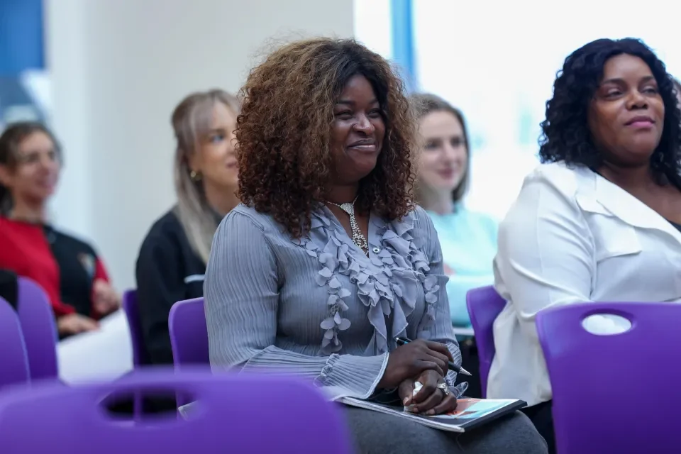 A group of women listening to a lecture