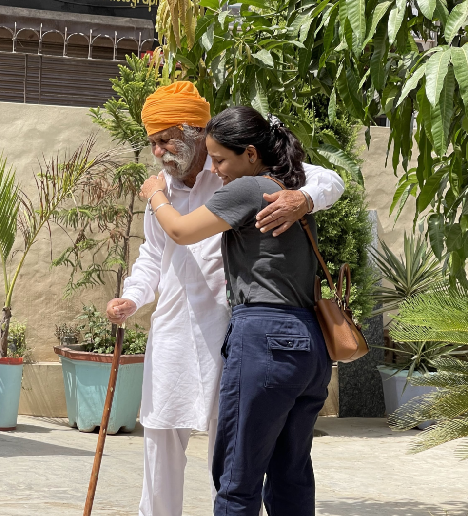 Jagdishar Singh SIdhu hugging his granddaughter