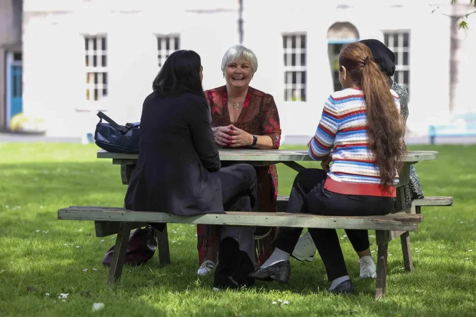 colleagues chatting outside in St Pats