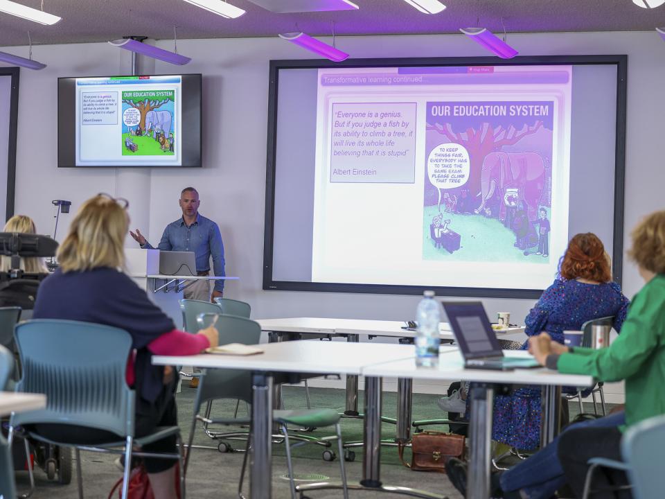 Shows Dr Kevin Merry deliving UDL workshop to DCU staff