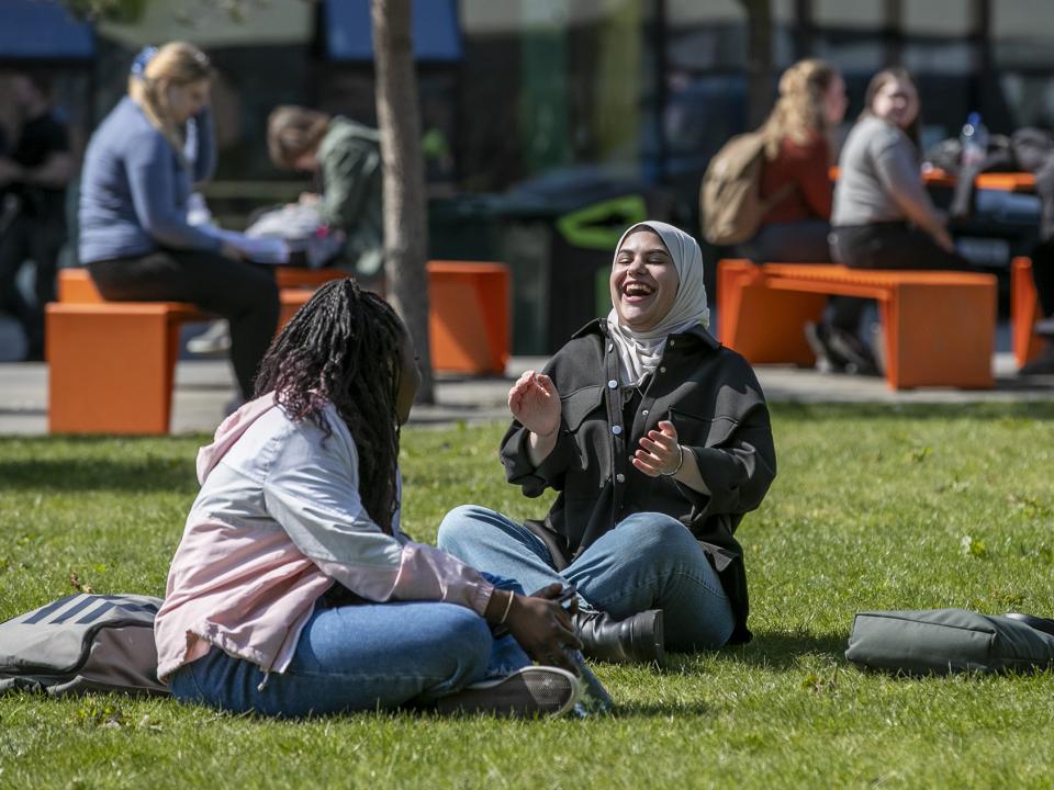 Shows two students on DCU's Glasnevin campus