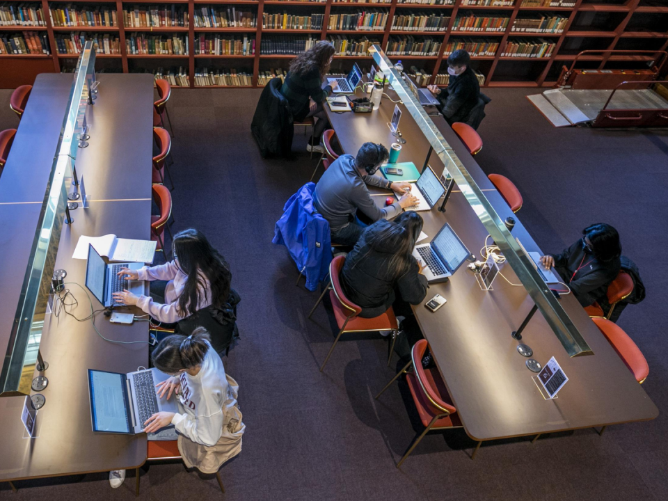 students studying in Woodlock Hall library