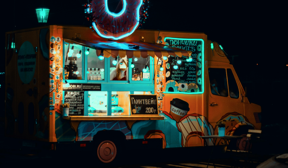 Food truck illuminated by blue fluorescent lights