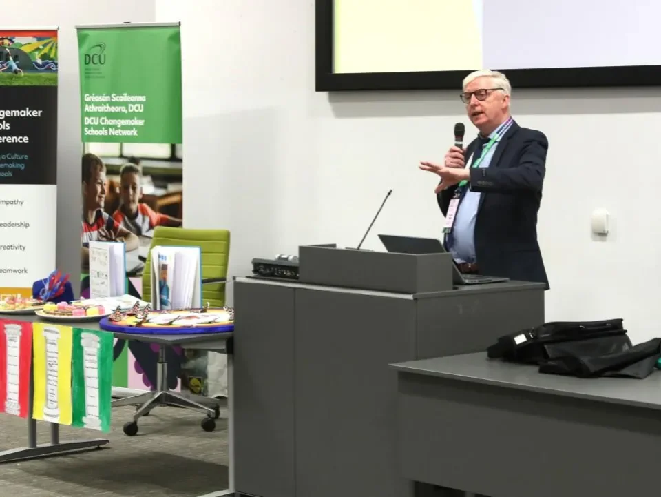 Dr. John White speaking during the opening address of the conference