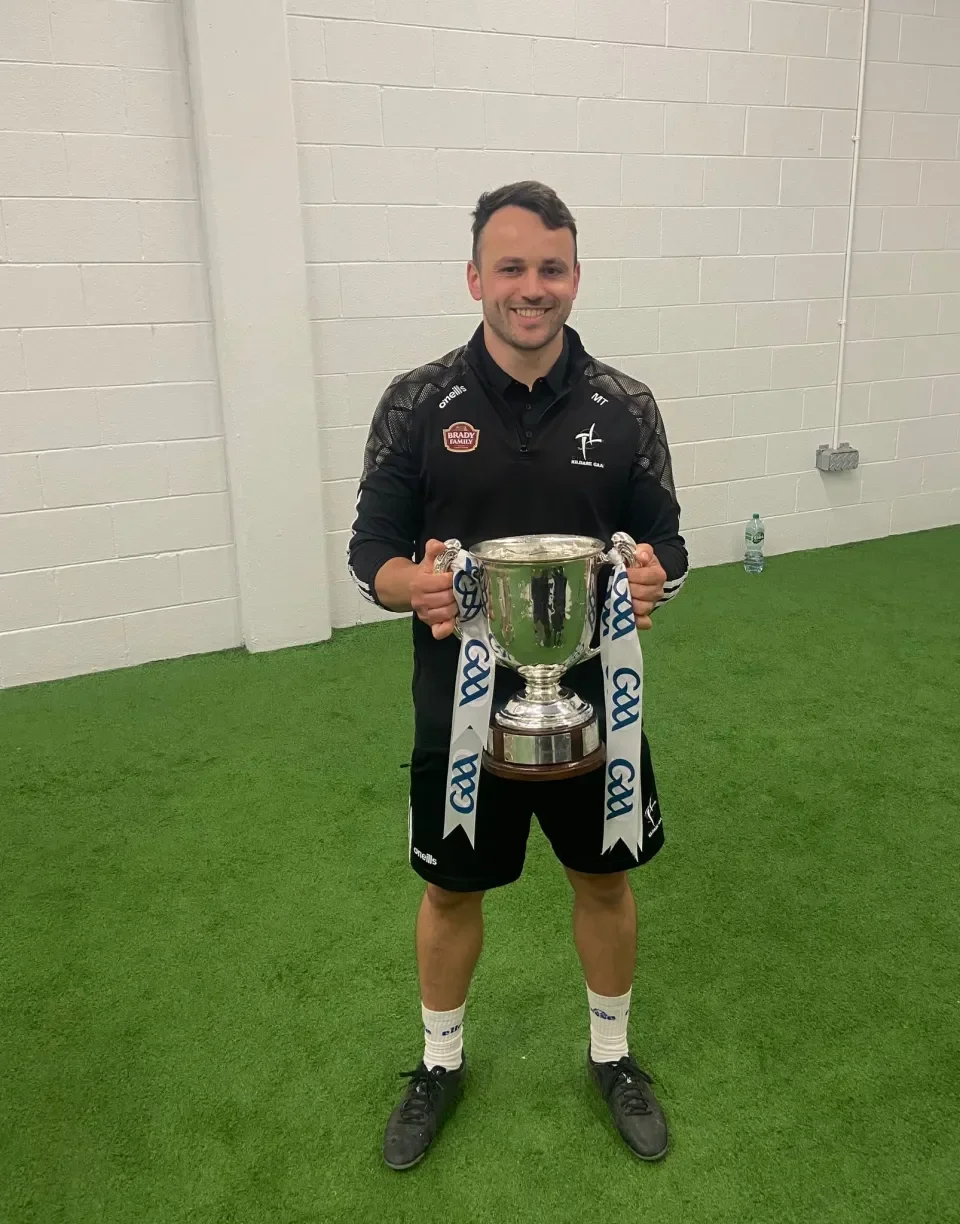 Maftei Ionut Tarmure holding Joe McDonagh cup 2025