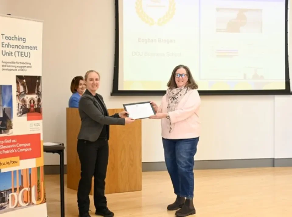 Dr. Colette Reel accepting the award on behalf of Eoghan Brogan from Dr. Monica Ward, Dean of Teaching and Learning