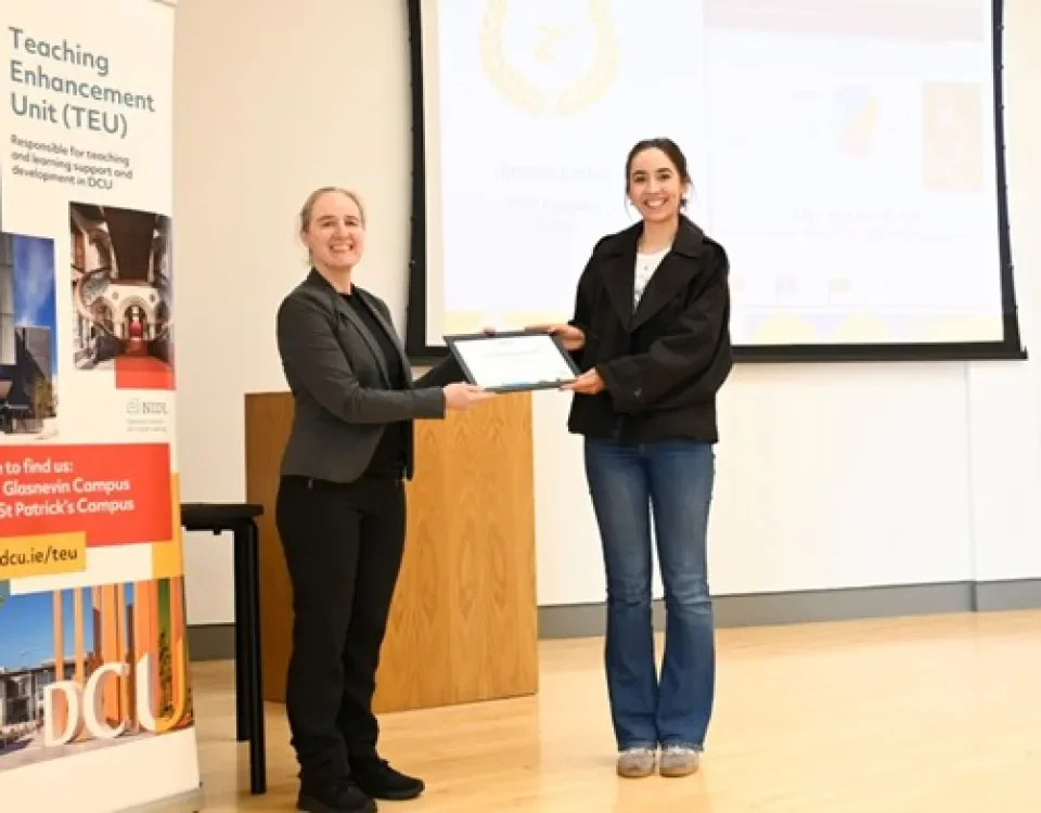 Jessica Larkin accepting her award from Dr. Monica Ward, Dean of Teaching and Learning