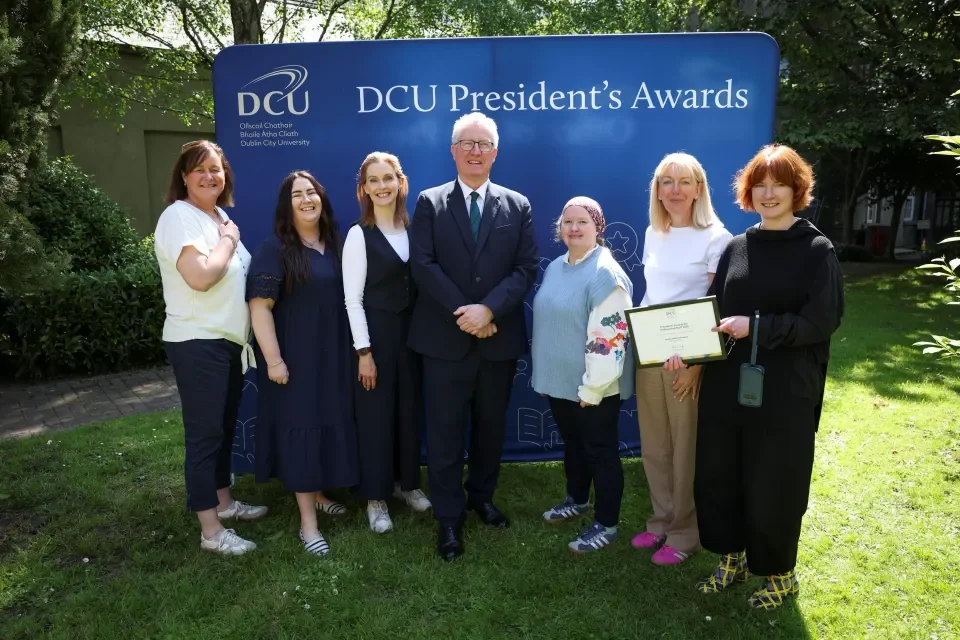 Faculty Office Colleagues holding award alongside President Daire Keogh