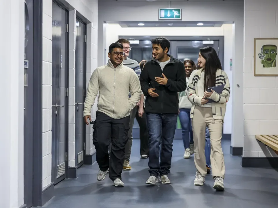 Students walking down corridor