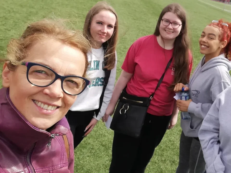 Access Officer Laurence Van der Haegen taken a photo with 3 female student ambassadors and coworker