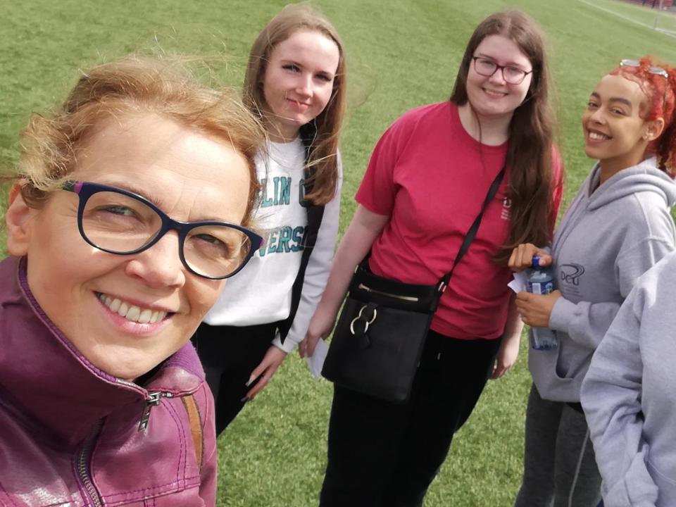 Access Officer Laurence Van der Haegen taken a photo with 3 female student ambassadors and coworker