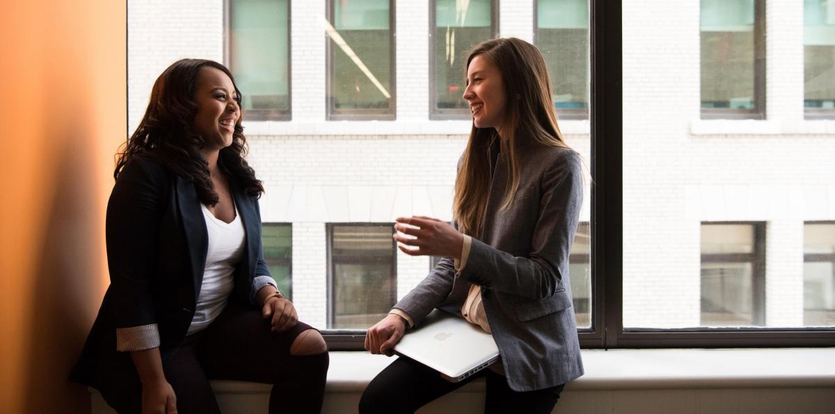 Two young women chatting