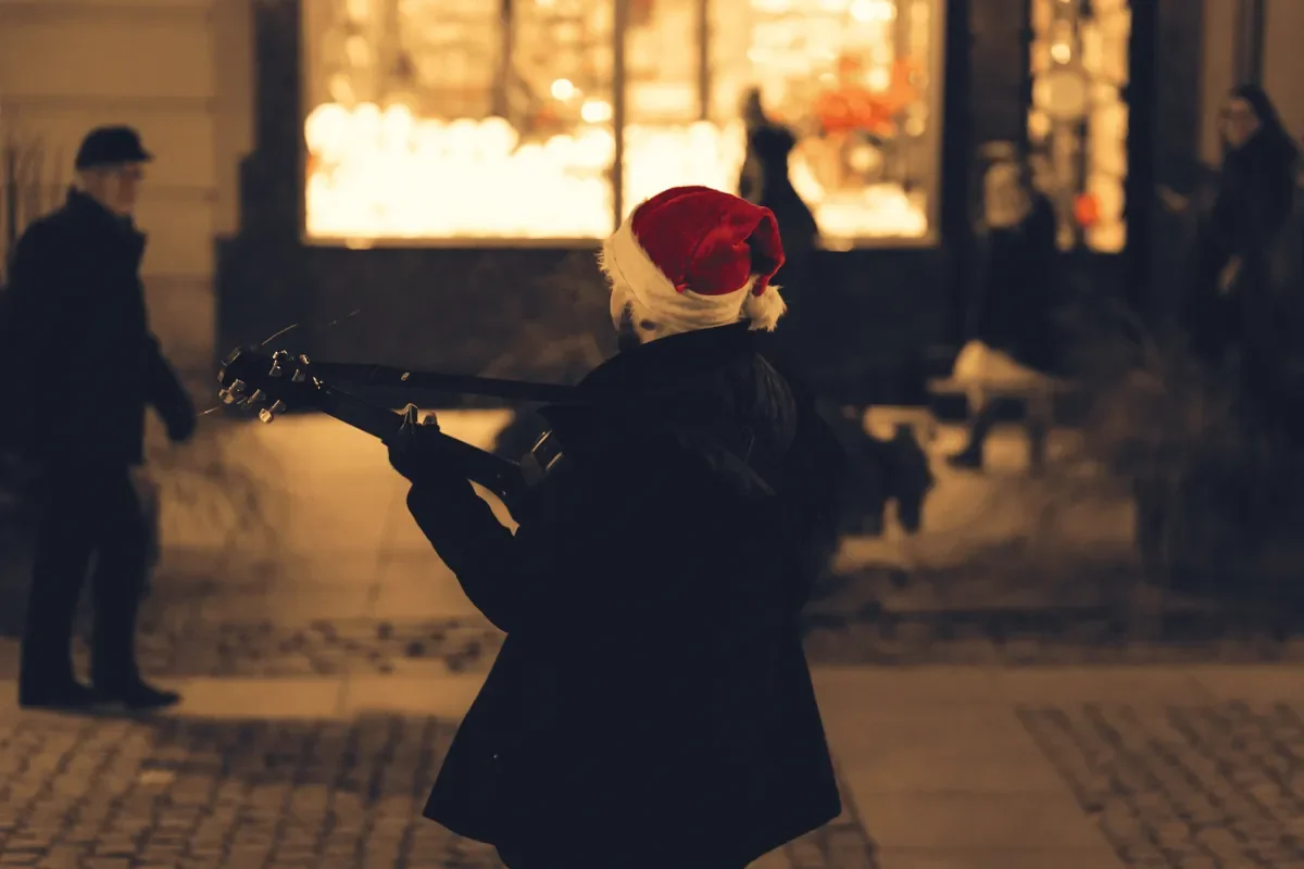 A busker singing Christmas carols