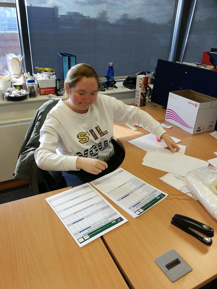 Learner working at a desk during work placement at DCU Business School