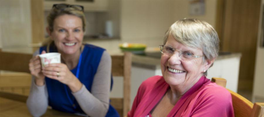 Two women chatting over tea