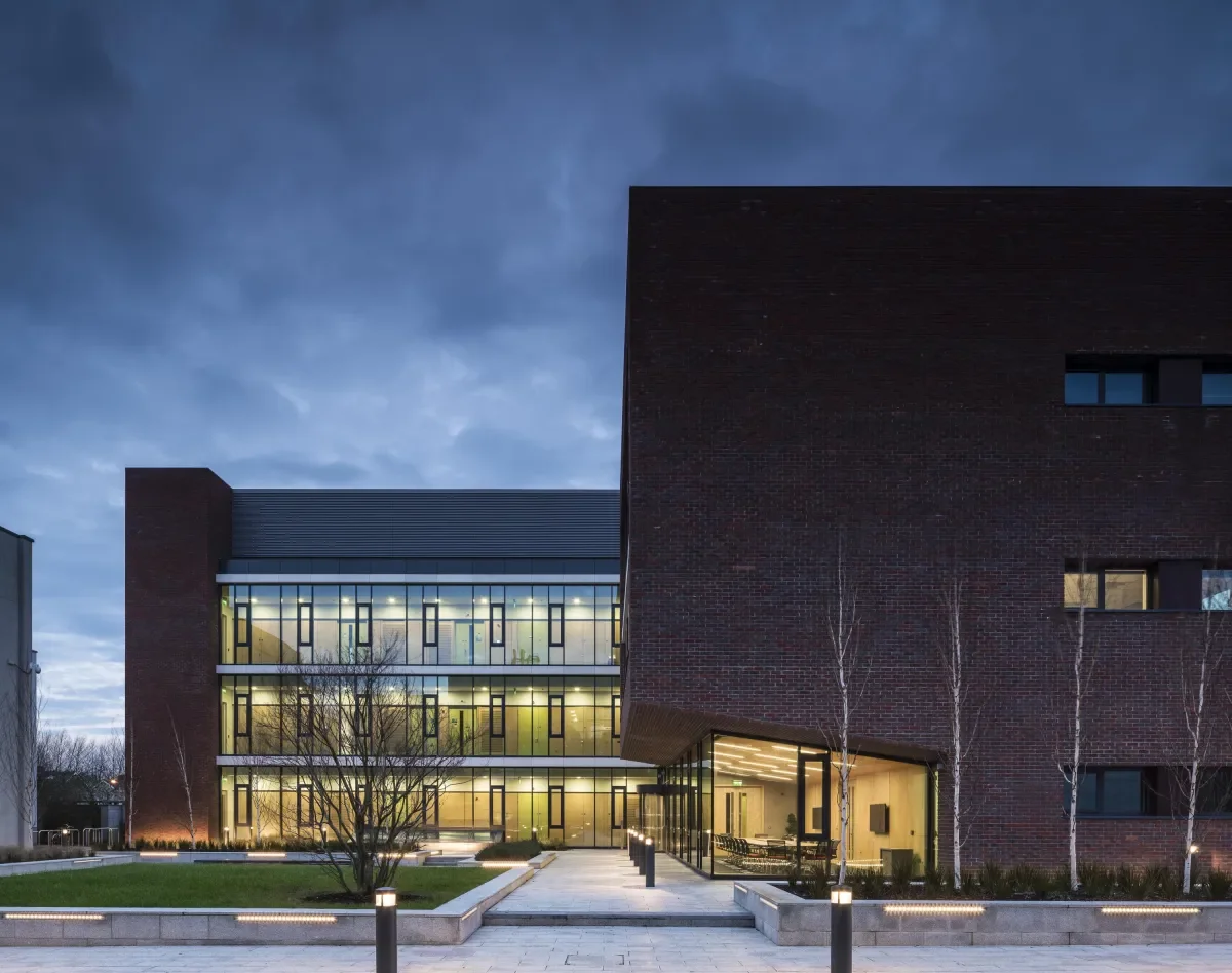 The NRF building at night with internal lights on
