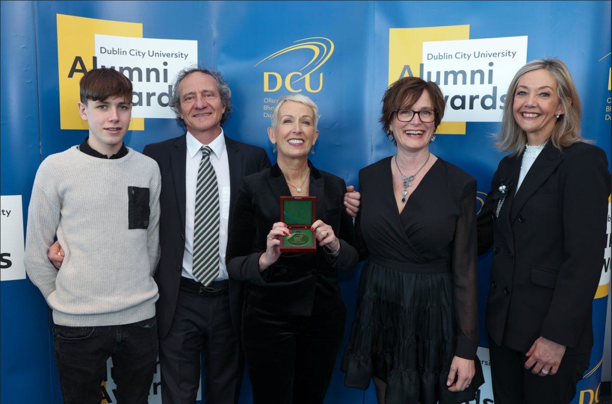 Awardees in front of DCU step and repeat
